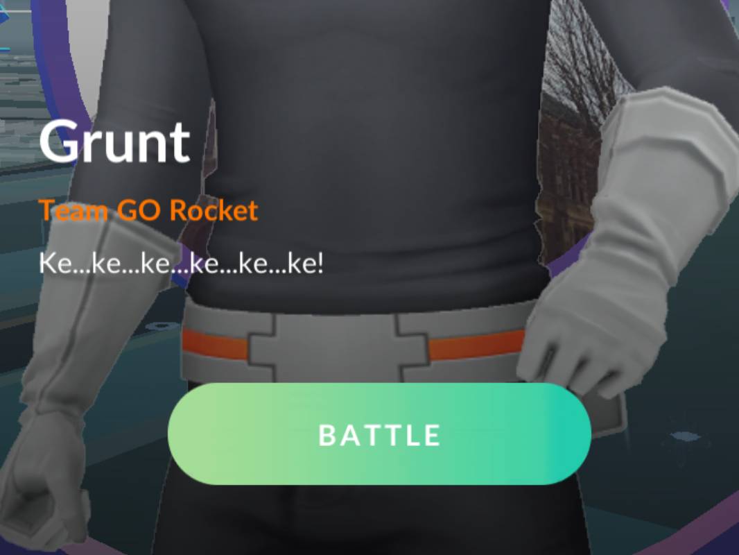 A screenshot of Pokémon Go with the text 'Grunt', 'Team GO Rocket', 'Ke...ke...ke...ke...ke...ke!' and 'Battle'.